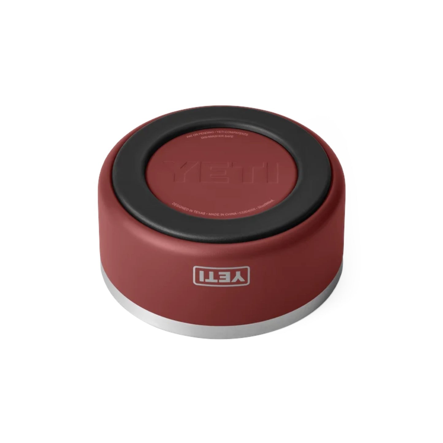 A YETI insulated container or cup with a matte red body, a black circular top, and a silver metallic base, shown on a clean white background.