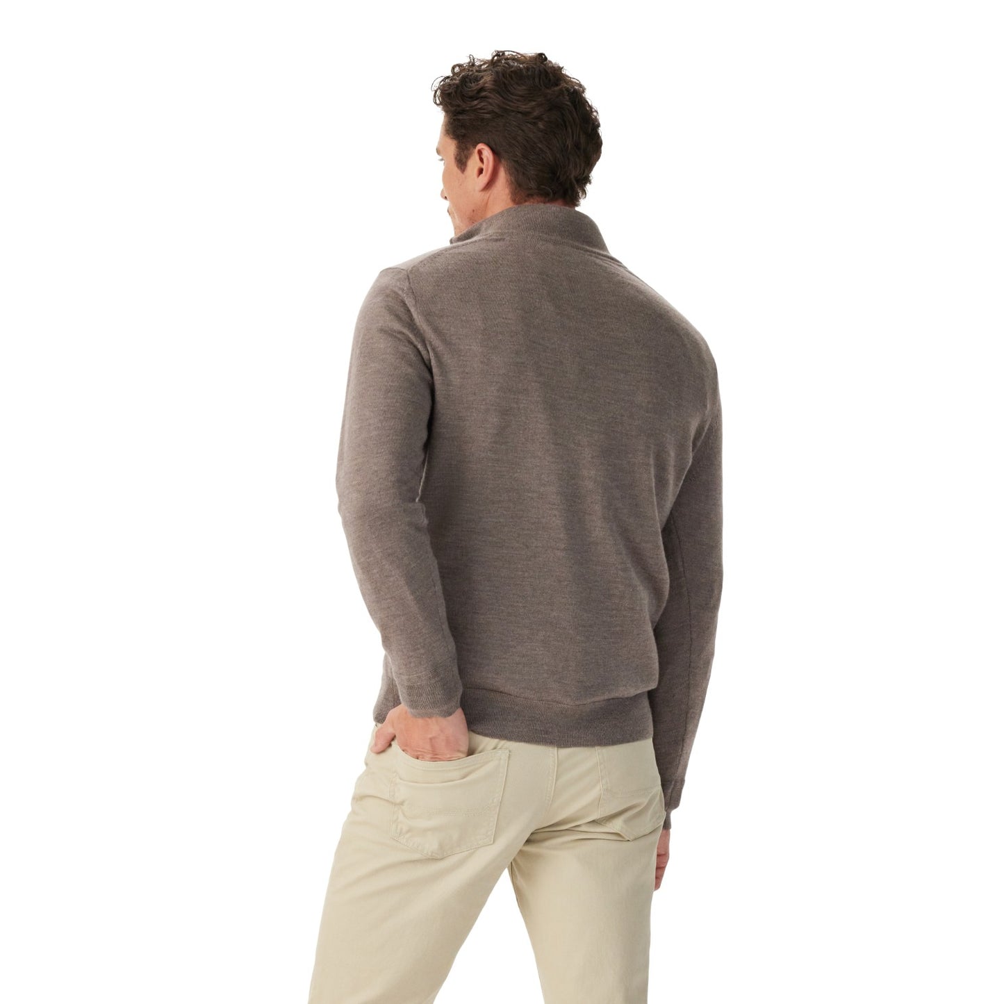 A man shown from the back wearing a taupe gray quarter-zip knit sweater and light beige trousers, photographed against a solid white background.