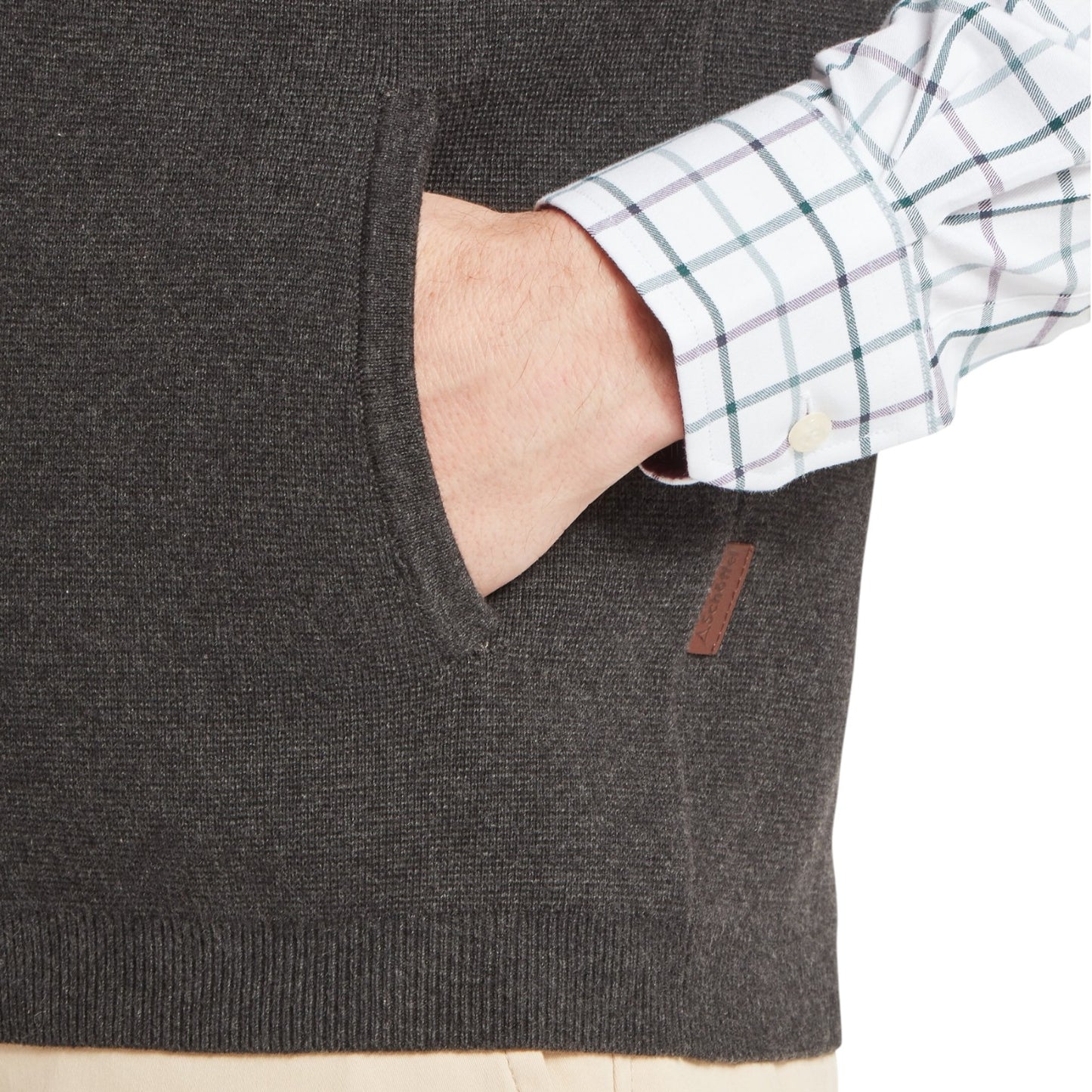 Gray sweater with a brand logo on a neutral background