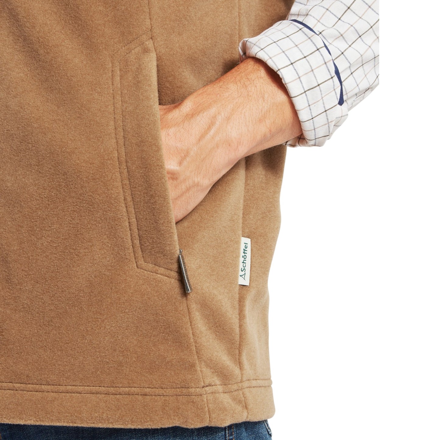 Close-up of a brown fleece jacket with a brand label on a white background