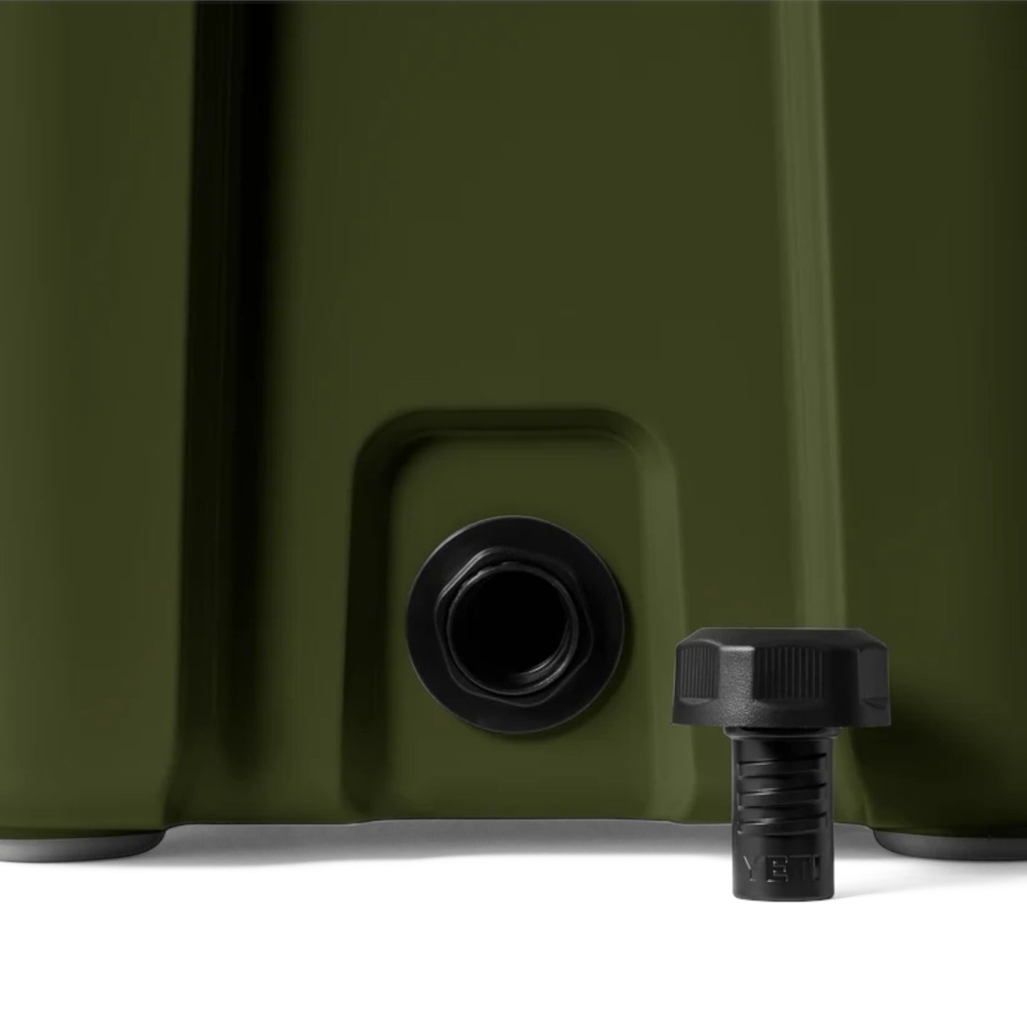 Close-up of an olive green container with a black drain port and a matching black cap placed in front on a white surface.