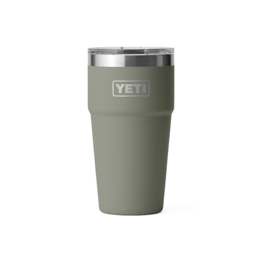 A matte sage green YETI insulated tumbler with a clear lid and a silver stainless steel rim, shown on a plain white background.