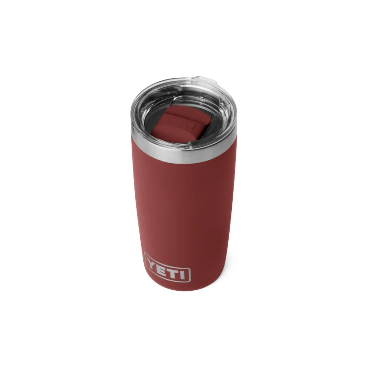A YETI insulated tumbler in a muted brick red color, featuring a stainless steel rim, a clear lid, and a matching red silicone straw cover inside. The YETI logo is printed near the bottom.