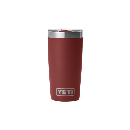 A YETI 20 oz vacuum-insulated tumbler in matte burgundy red with a stainless steel rim and lid, featuring the YETI logo on the front, set against a plain white background.