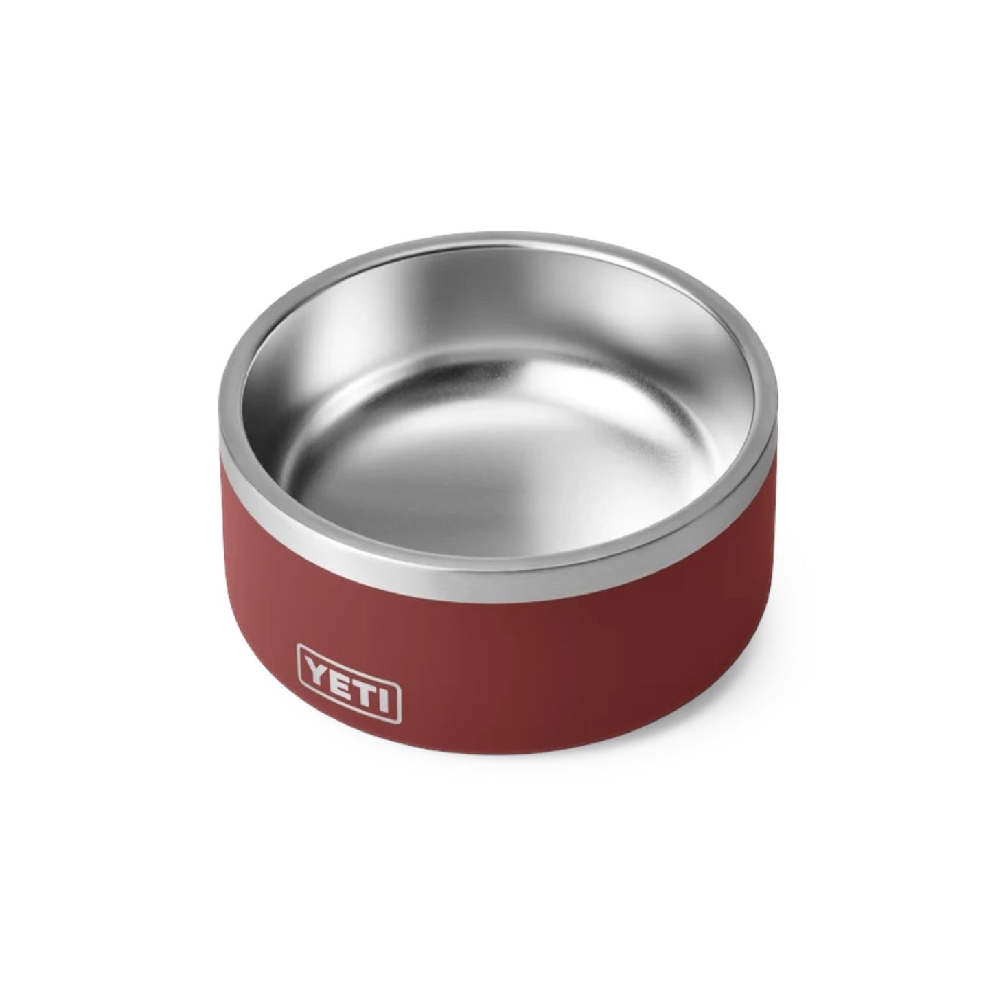 A YETI pet bowl with a matte red exterior and a polished stainless steel interior, shown on a clean white background.
