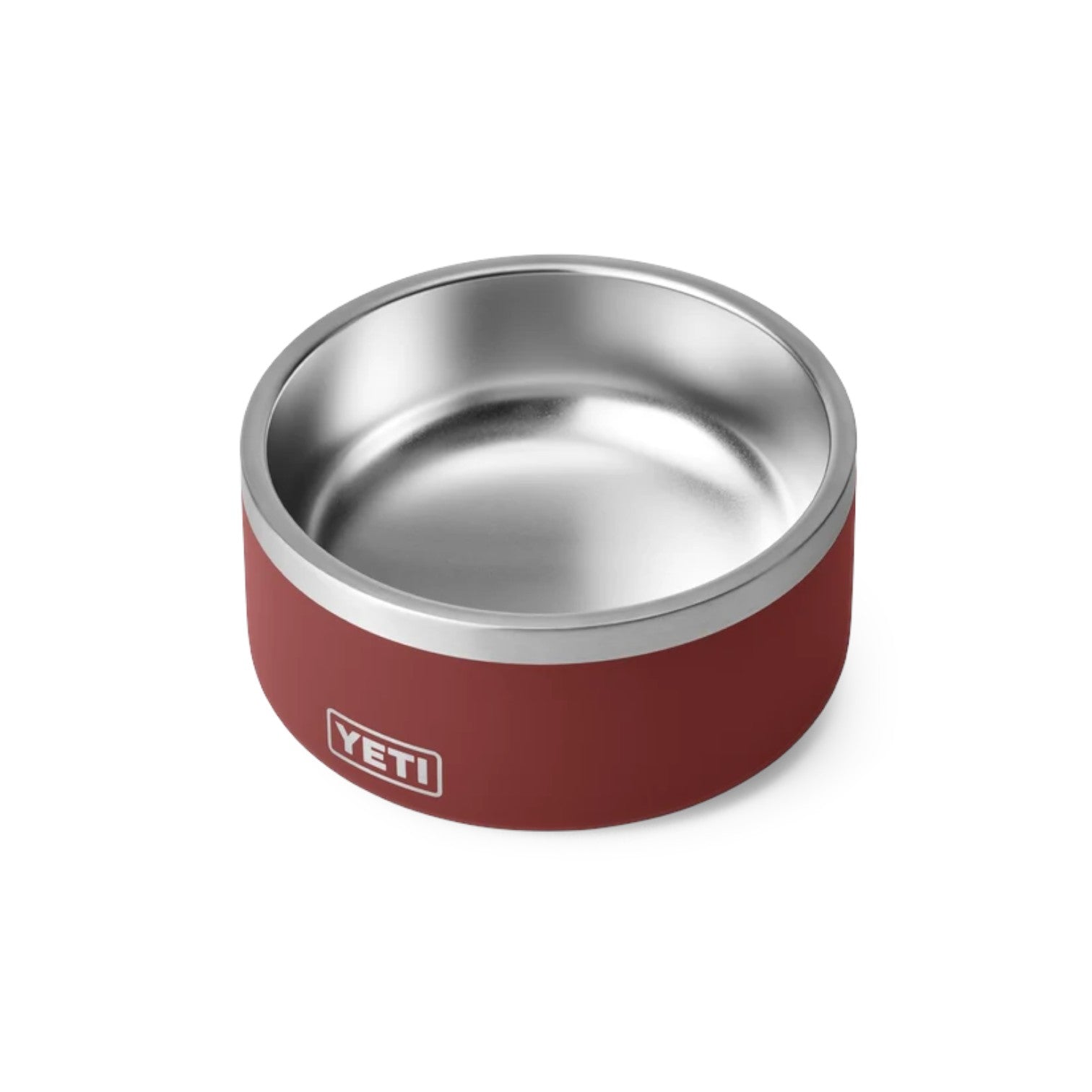 A YETI pet bowl with a matte red exterior and a polished stainless steel interior, shown on a clean white background.