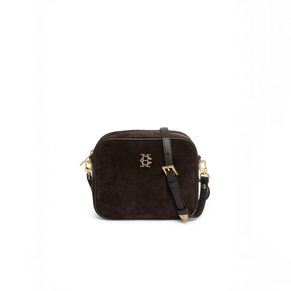 A dark brown suede crossbody bag with a black leather strap and gold-tone hardware, featuring a decorative interlocking 'HE' logo on the front, set against a plain white background.