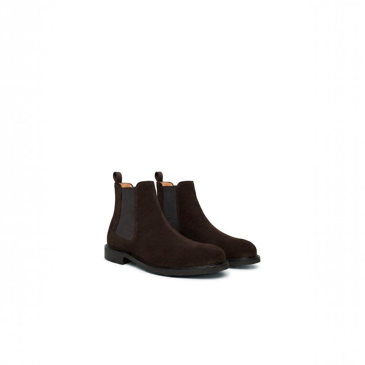 A pair of dark brown suede Chelsea boots with black elastic side panels and pull tabs, shown from a three-quarters angle on a solid white background.