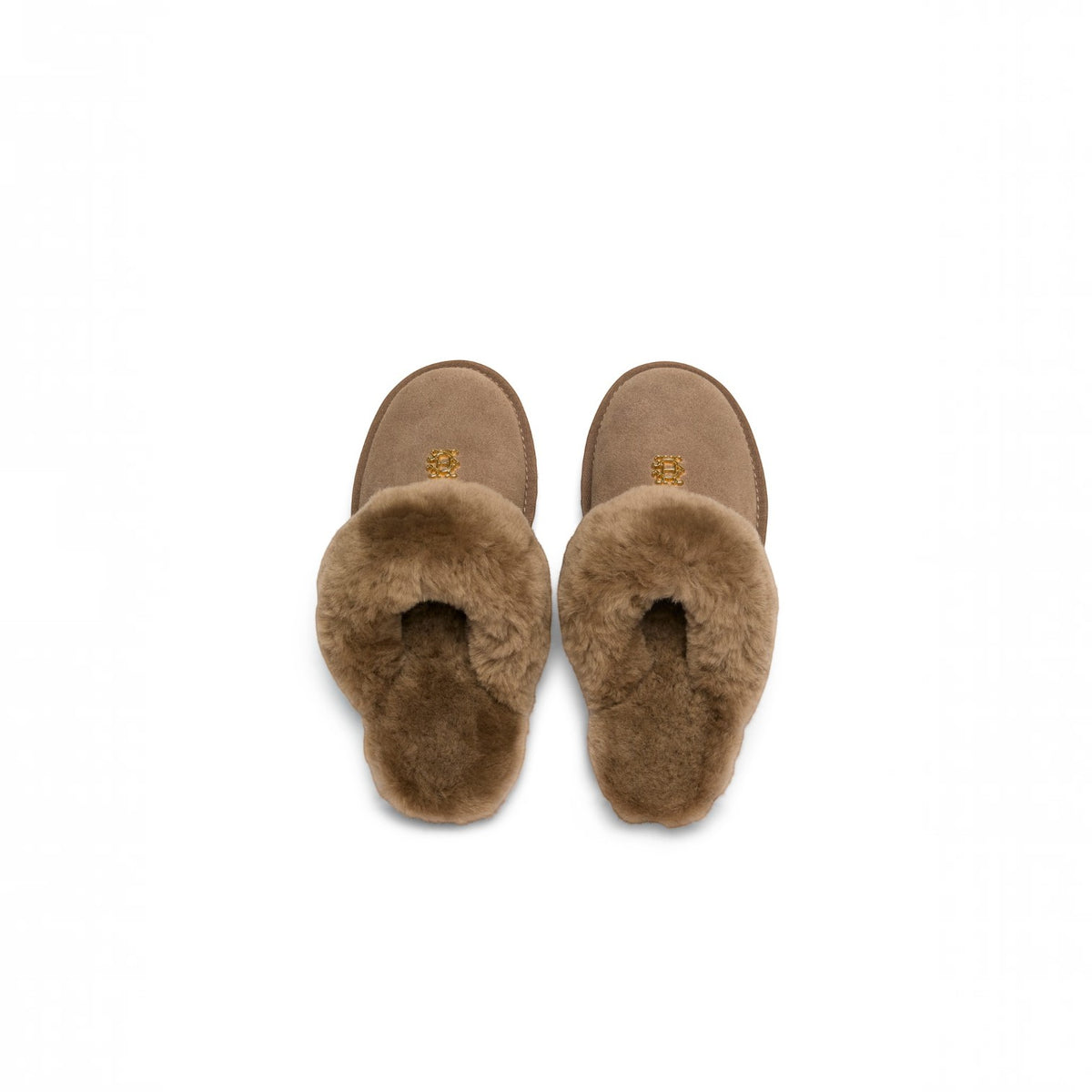 A pair of brown shearling slipper slippers with a suede-like brown base and a soft brown faux-fur trim, shown from a top-down view on a white background.