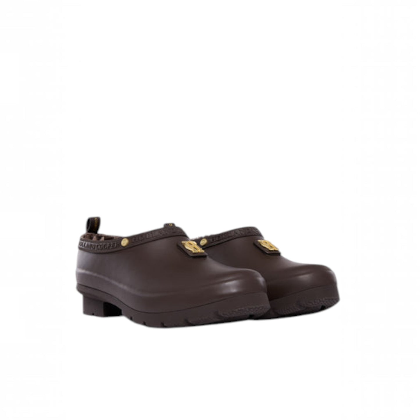 A pair of dark brown rubber clogs with small gold metal accents on the straps, shown against a plain white background.