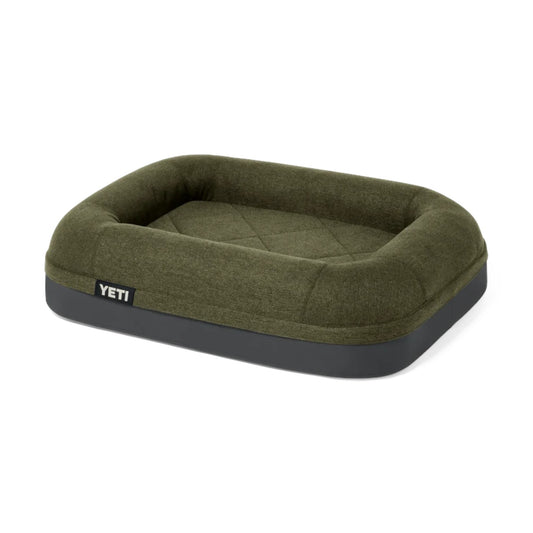 A YETI pet bed in olive green with a dark gray base, shown on a clean white background.