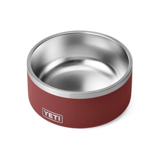 A YETI pet bowl with a matte burgundy exterior and a polished stainless steel interior, shown on a clean white background.