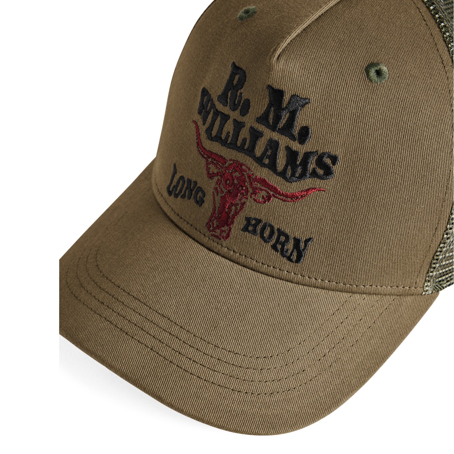 A close-up of a brown trucker hat featuring embroidered black text reading 'R. M.