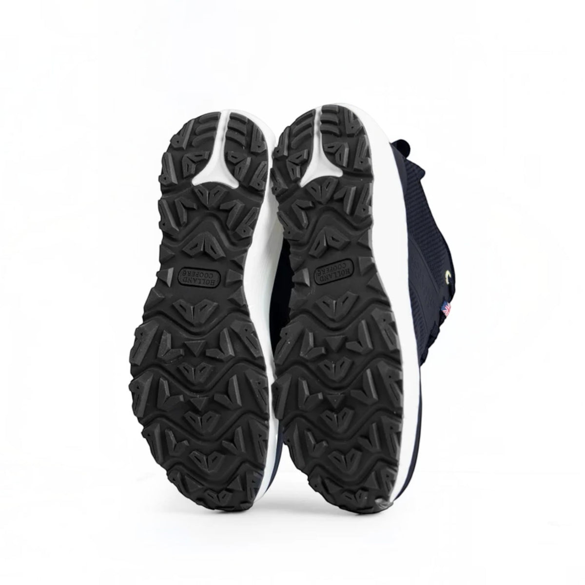 Black and white athletic shoes with sole details on a white background
