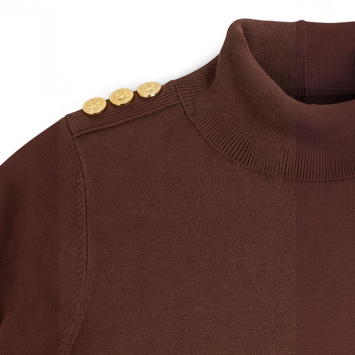 Close-up of a brown ribbed knit turtleneck sweater with three gold buttons on the shoulder, shown against a plain white background.