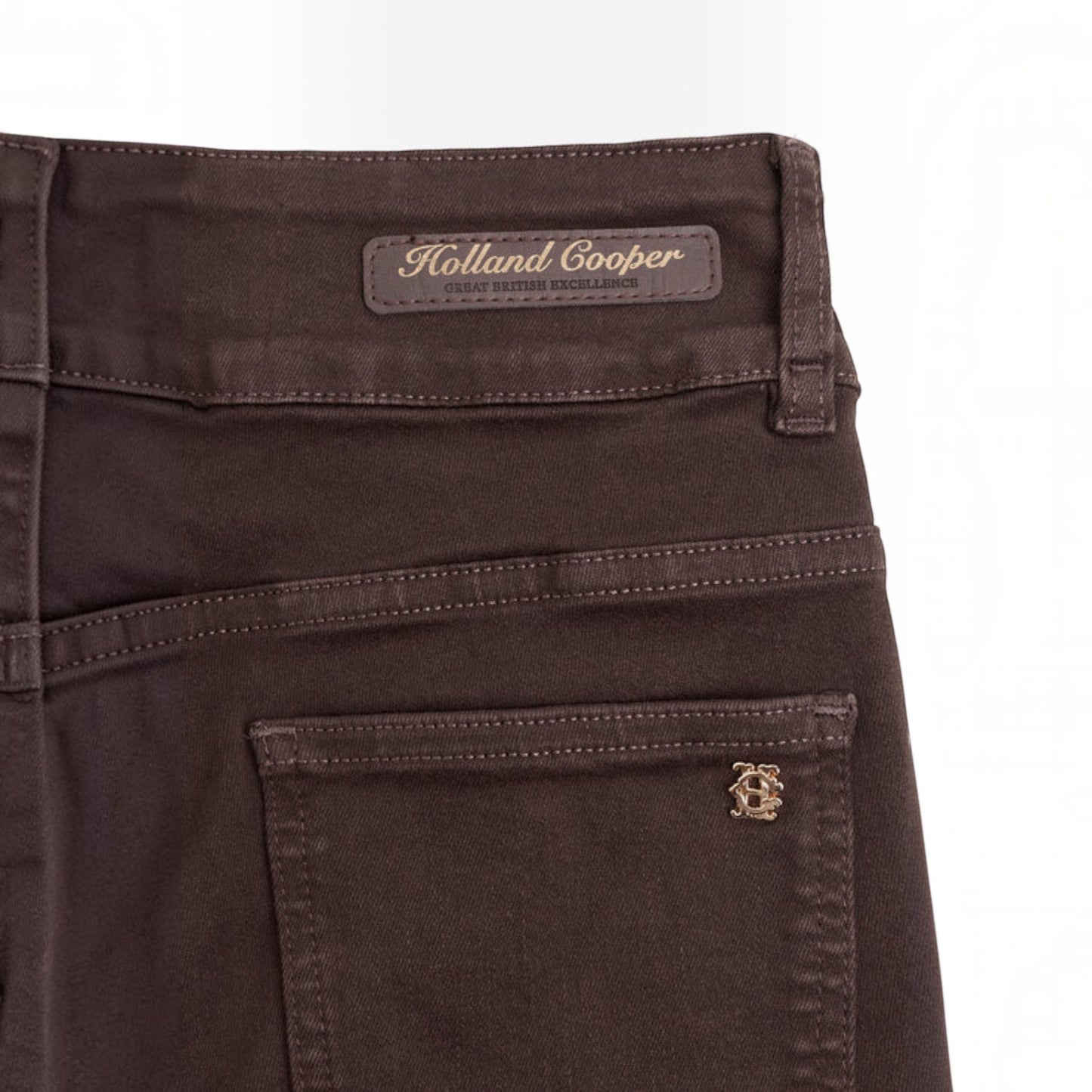 Brown blue pants with a green logo on a white background