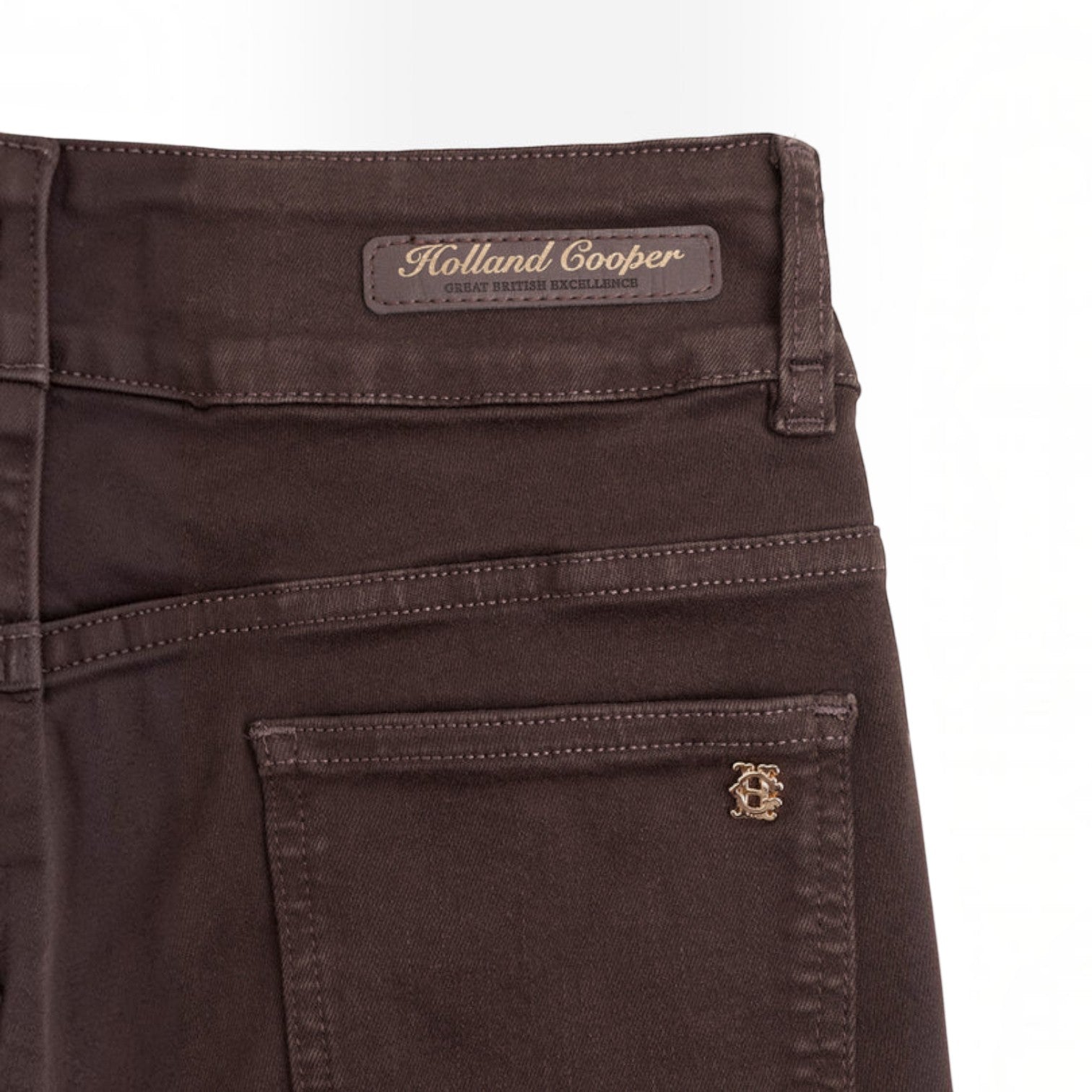 Brown blue pants with a green logo on a white background