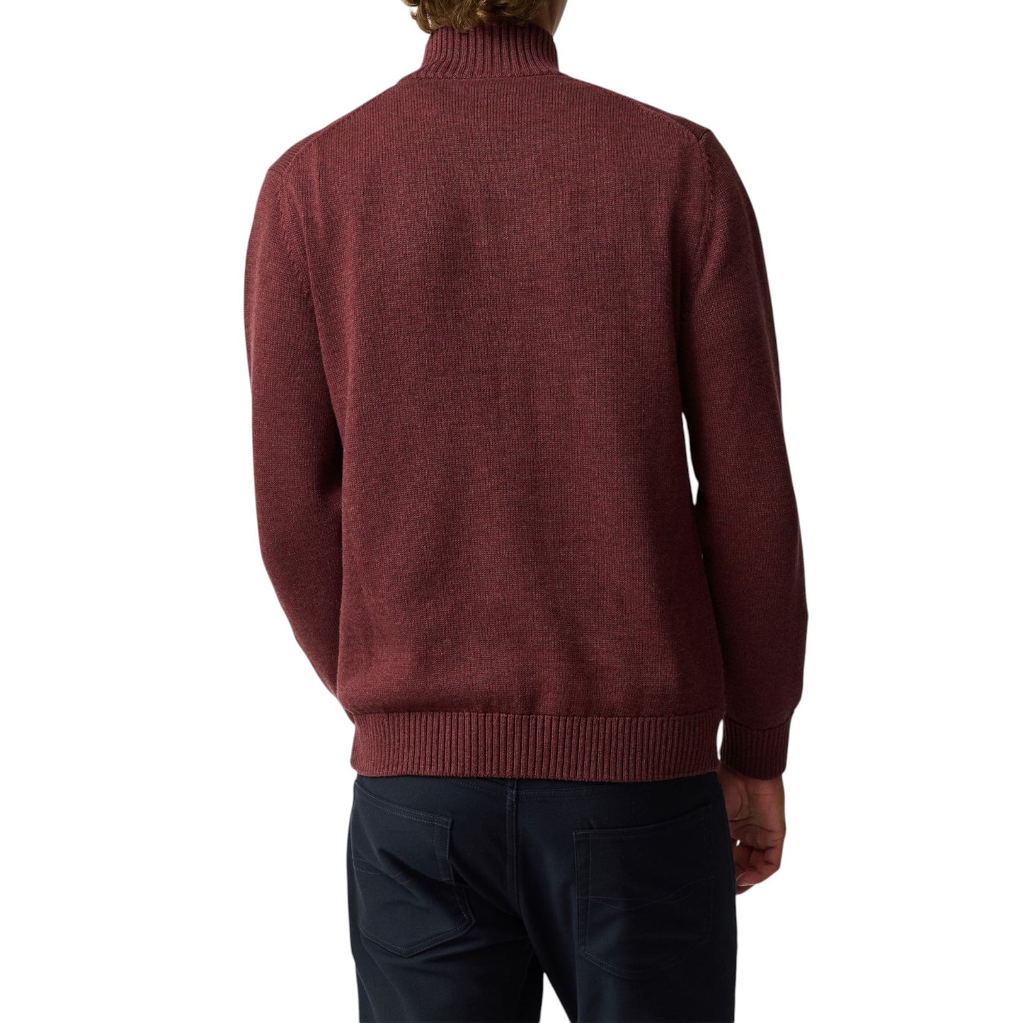 Maroon sweater worn by a person on a white background