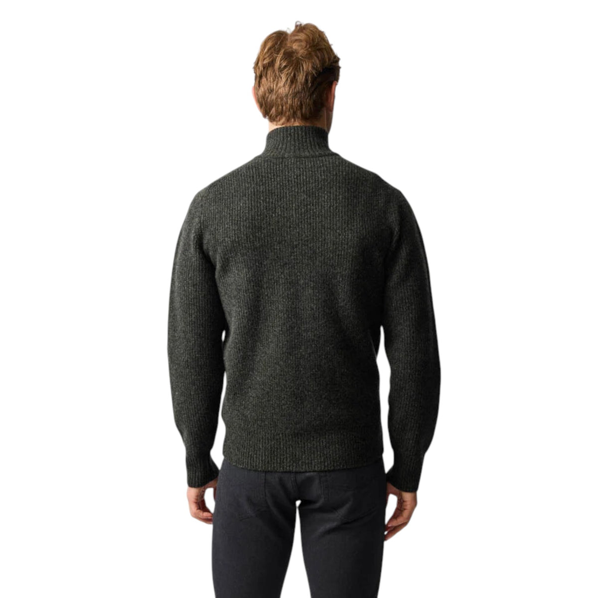 Man wearing a dark gray turtleneck sweater on a white background
