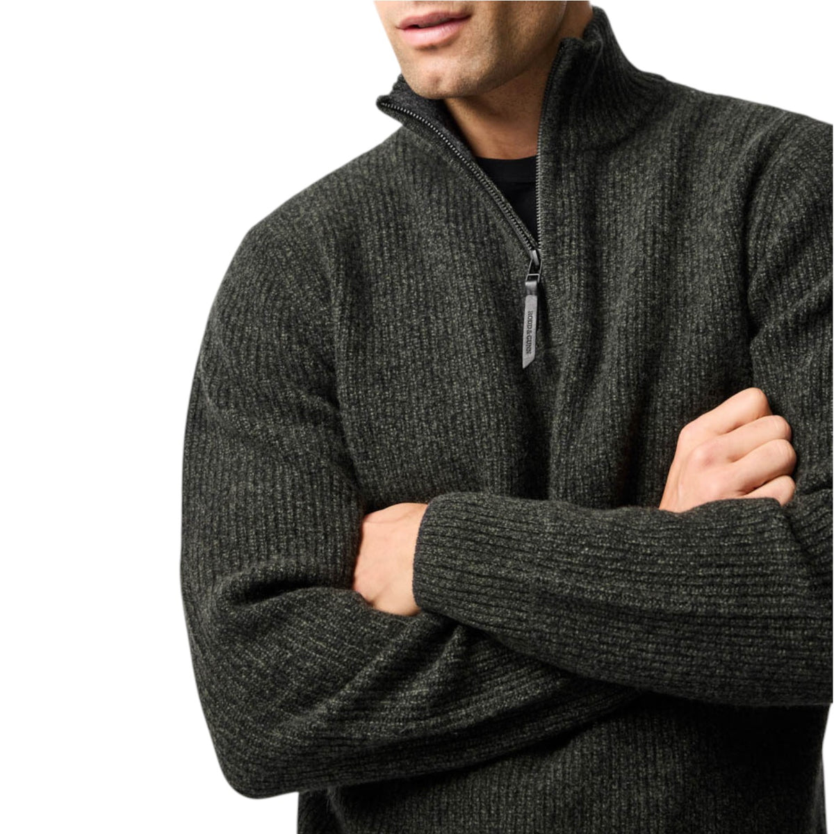 Man wearing a dark gray zip-up sweater on a white background