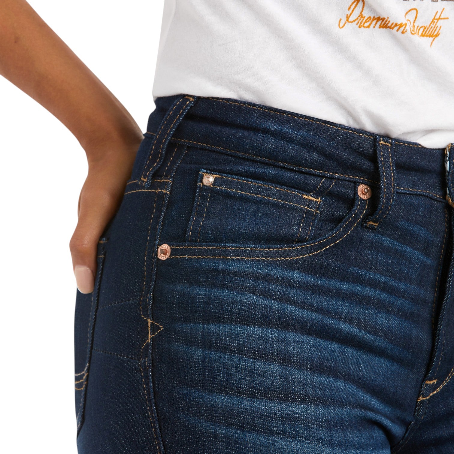 Close-up of blue jeans with a white shirt and 'Premium Quality' text in the background
