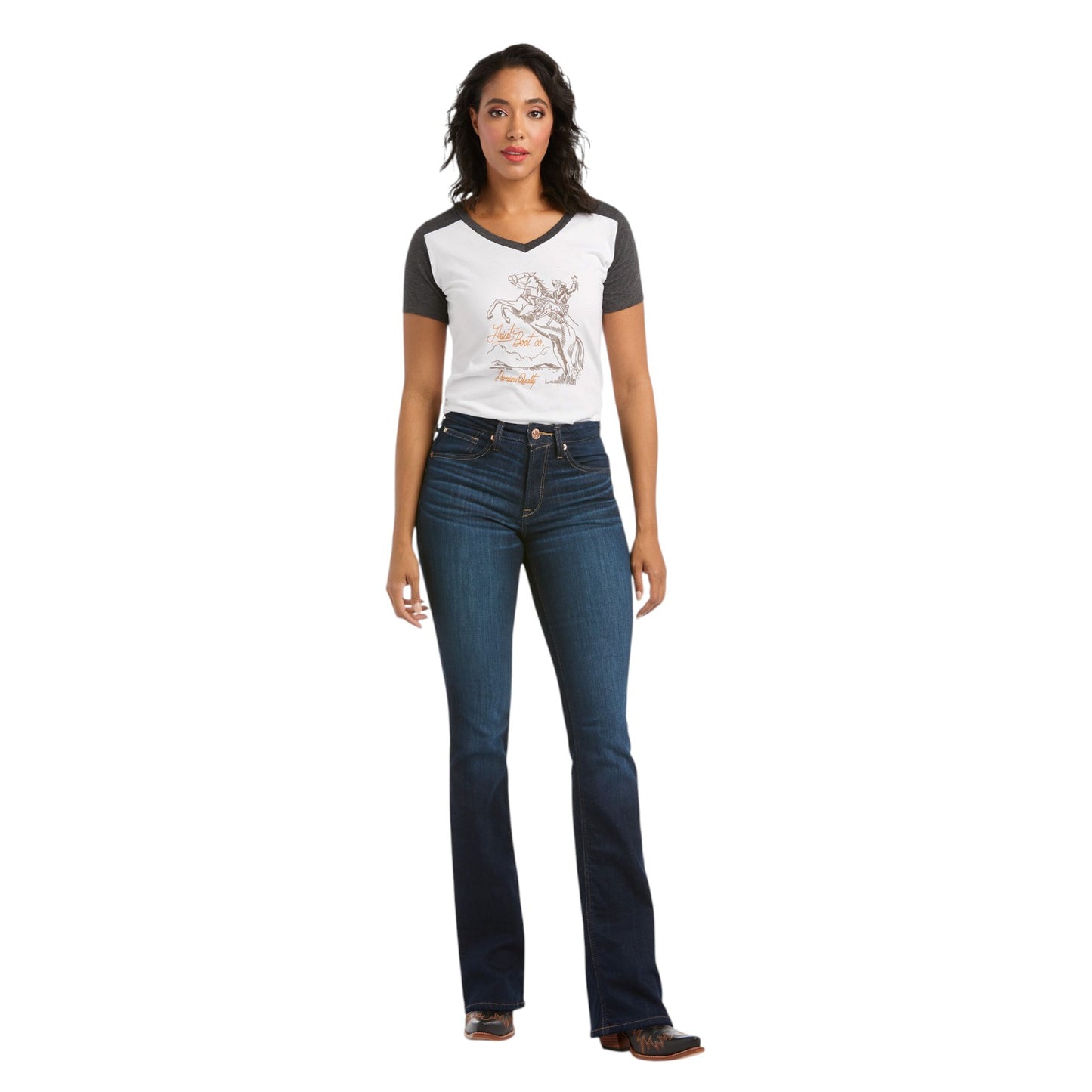 Woman wearing a graphic t-shirt and blue jeans on a white background