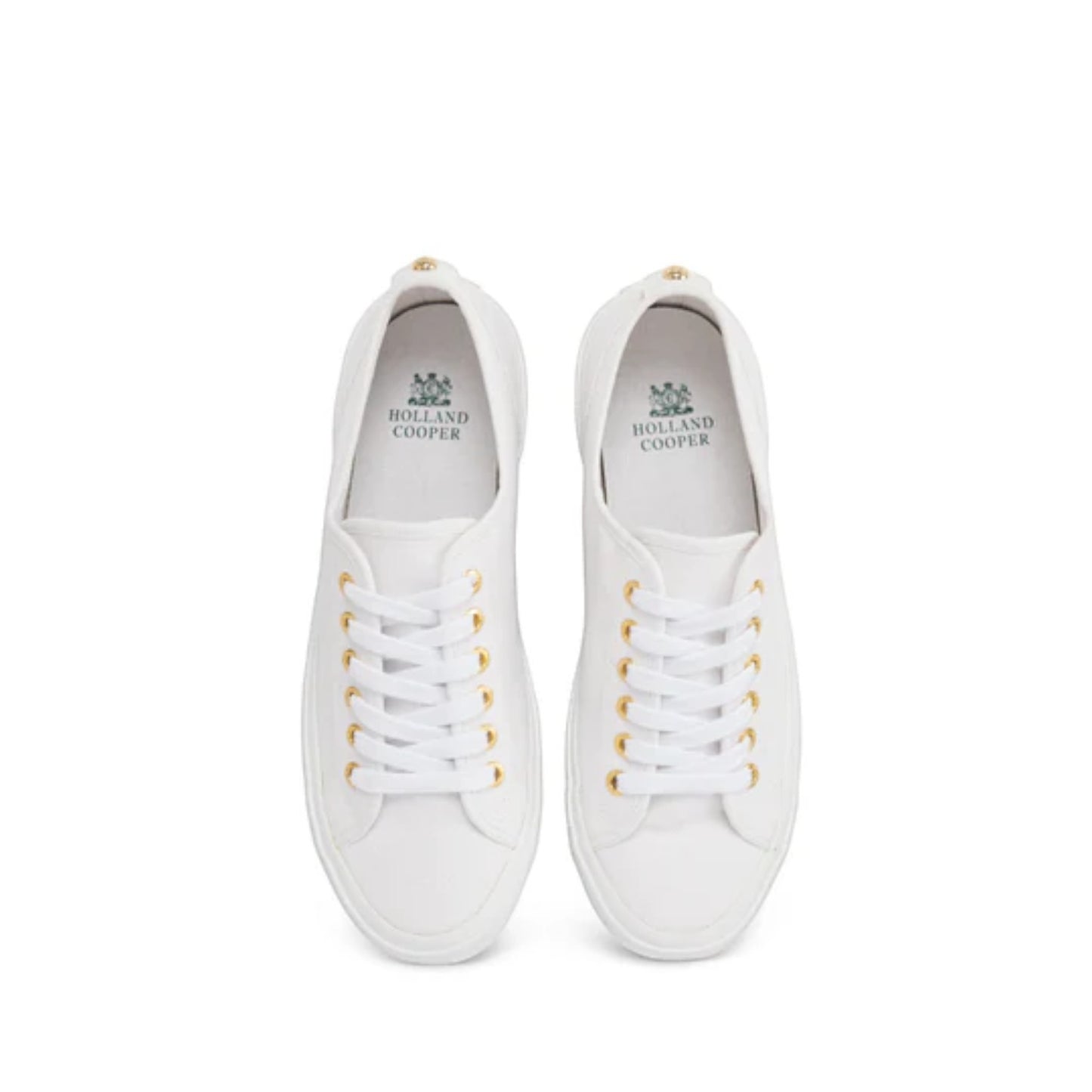 Pair of white sneakers with gold laces on a white background