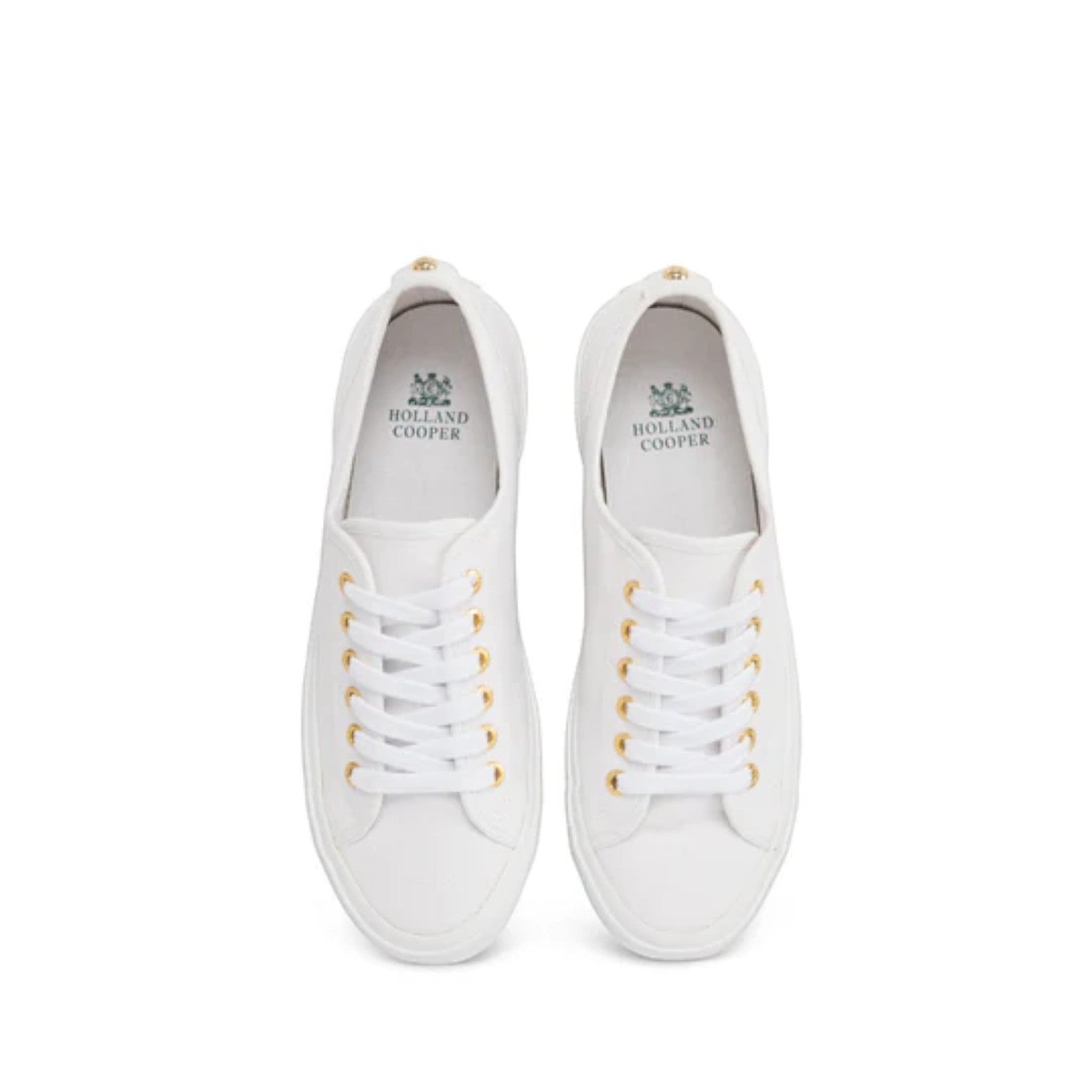 Pair of white sneakers with gold laces on a white background