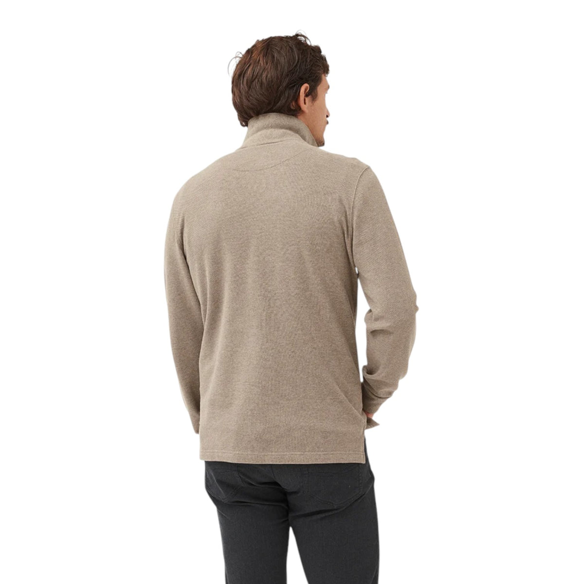 Man wearing a beige sweater on a white background