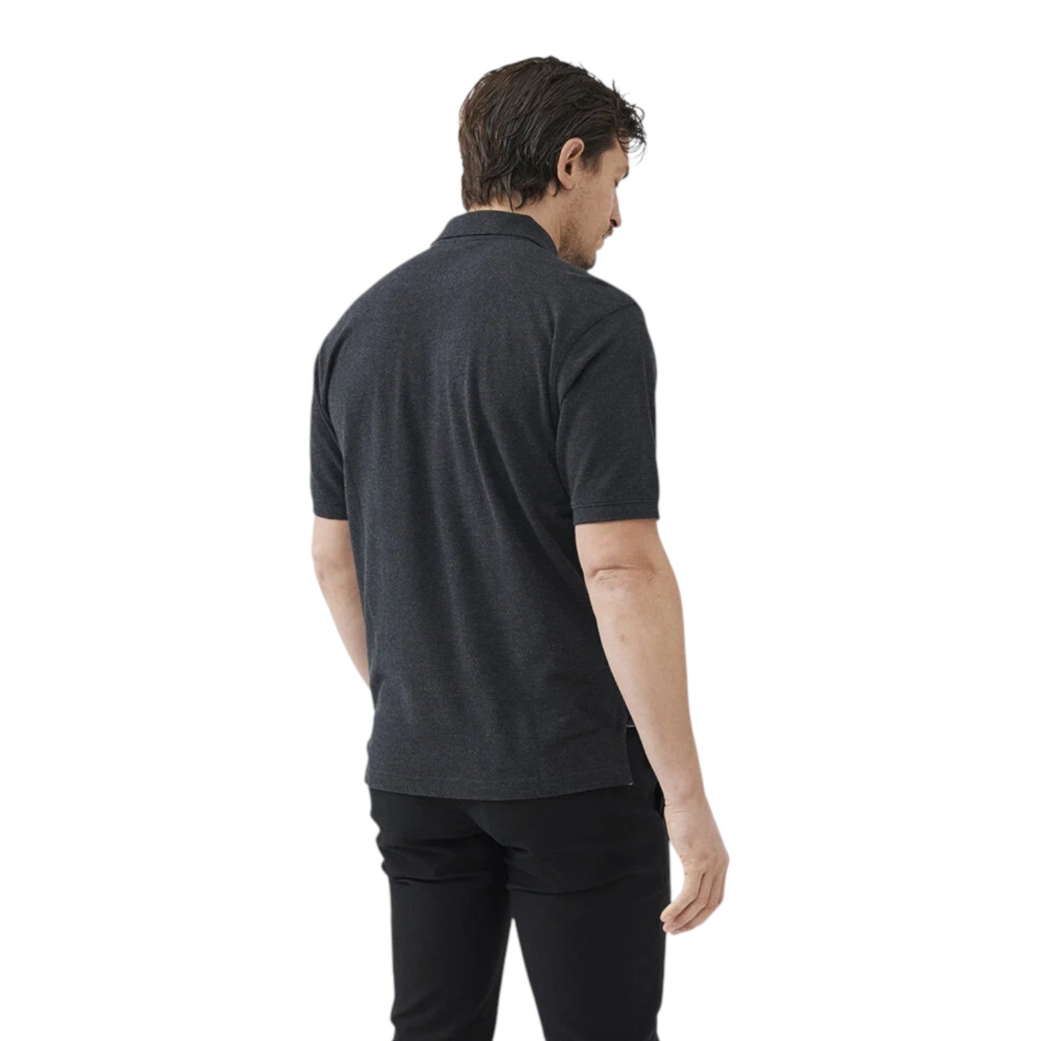 Man wearing a dark gray polo shirt and black pants on a white background