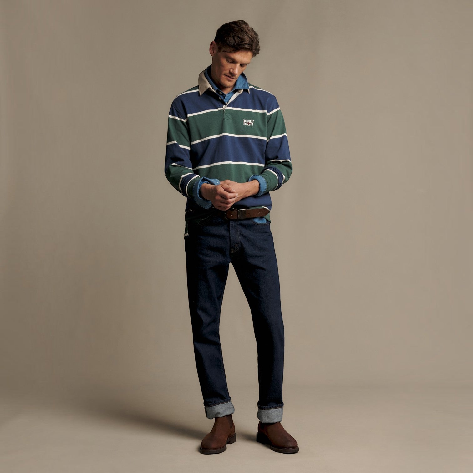 Man wearing R.M Williams green and navy stripe rugby shirt