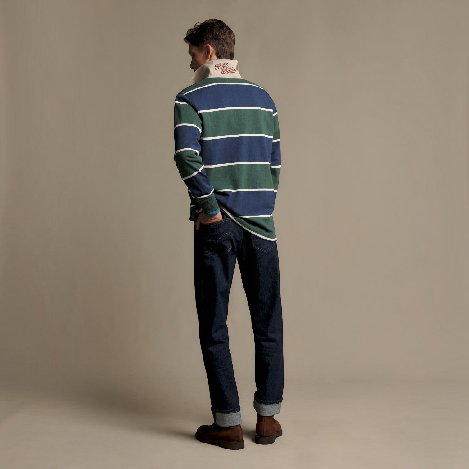 Man wearing R.M Williams green and navy stripe rugby shirt