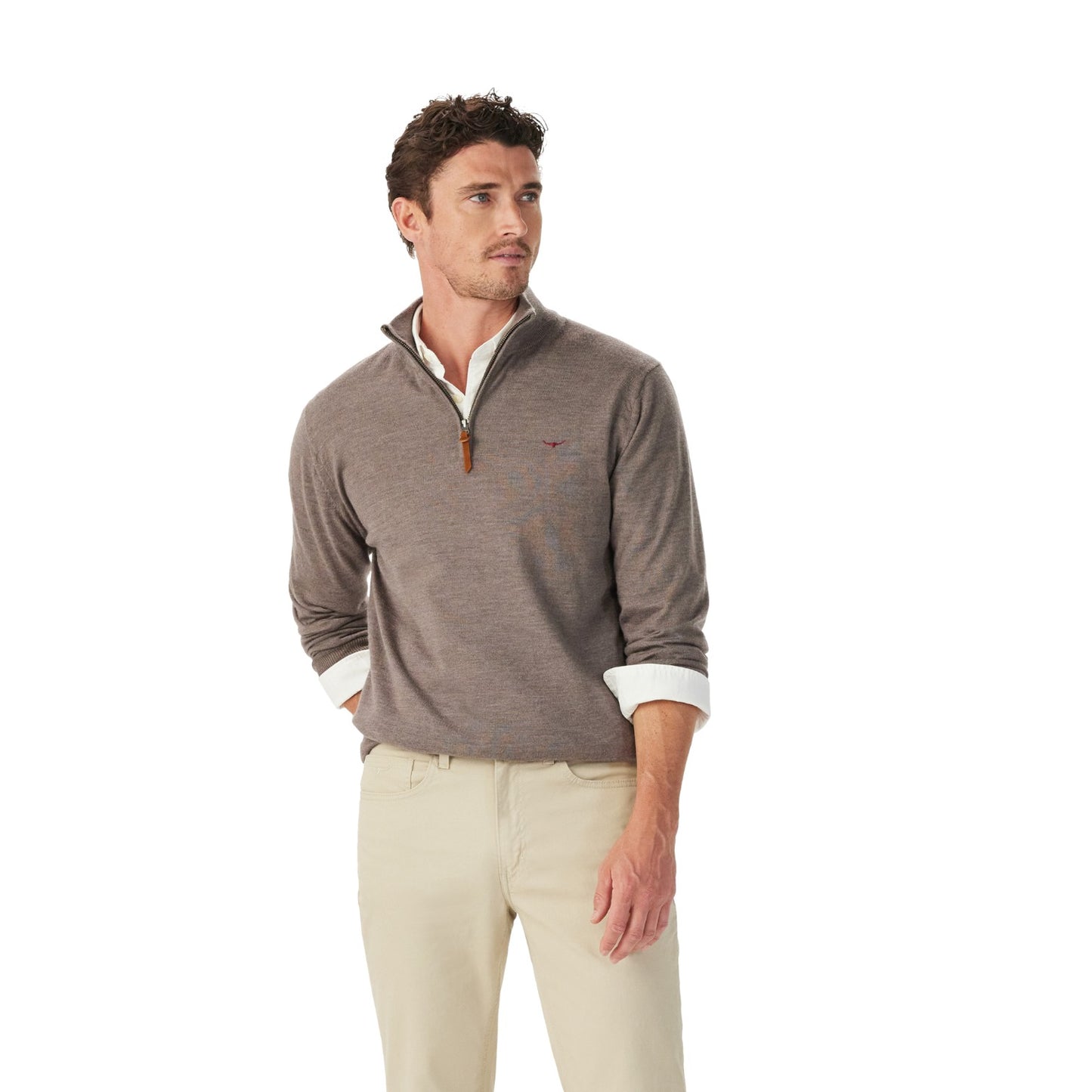 A man wearing a taupe heathered quarter-zip pullover sweater with a white collar and cuffs, paired with beige trousers, photographed against a solid white background.