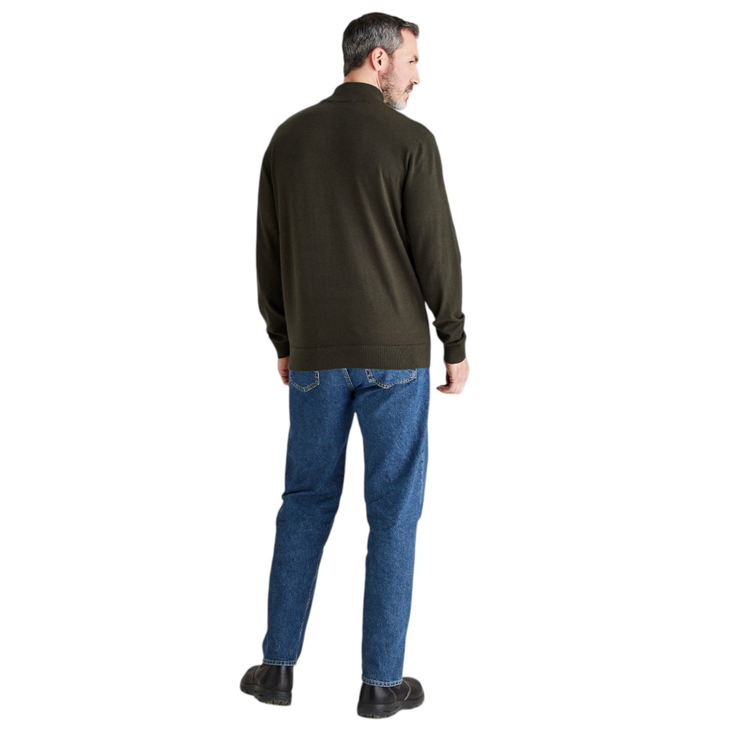 A man shown from the back wearing an olive green quarter-zip pullover sweater, blue jeans, and dark brown shoes, set against a plain white background.