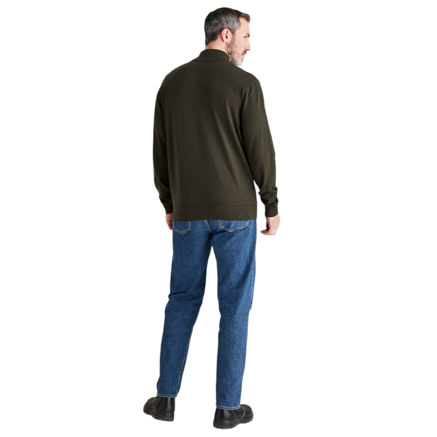 A man shown from the back wearing an olive green quarter-zip pullover sweater, blue jeans, and dark brown shoes, set against a plain white background.