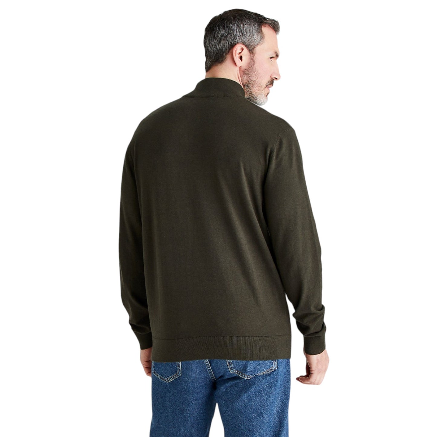 A man viewed from the back wearing an olive green knit sweater and blue jeans against a plain white background.