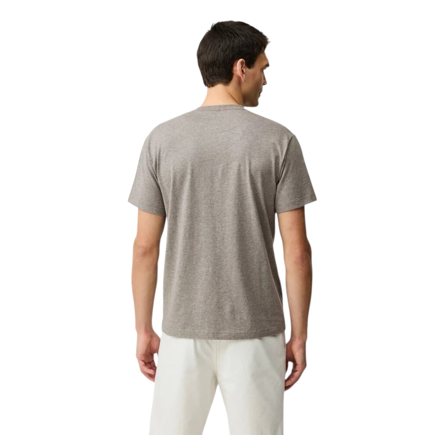 Man wearing a gray t-shirt and white pants on a white background