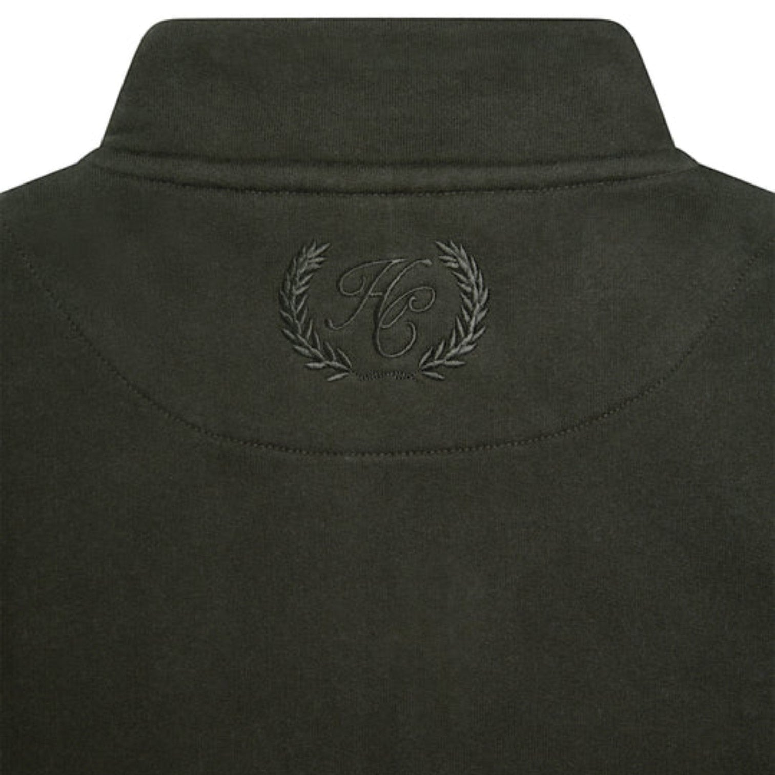 Dark green jacket with a logo on the collar against a white background