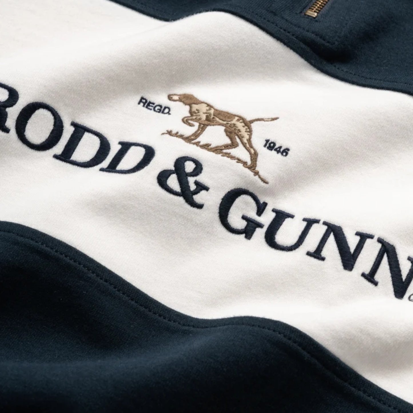 Close-up of a logo on a piece of clothing with 'Rodd & Gunn' branding.