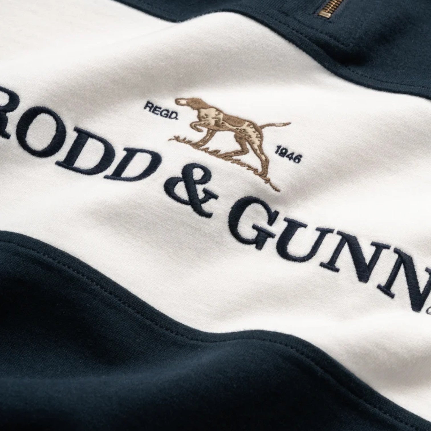 Close-up of a logo on a piece of clothing with 'Rodd & Gunn' branding.