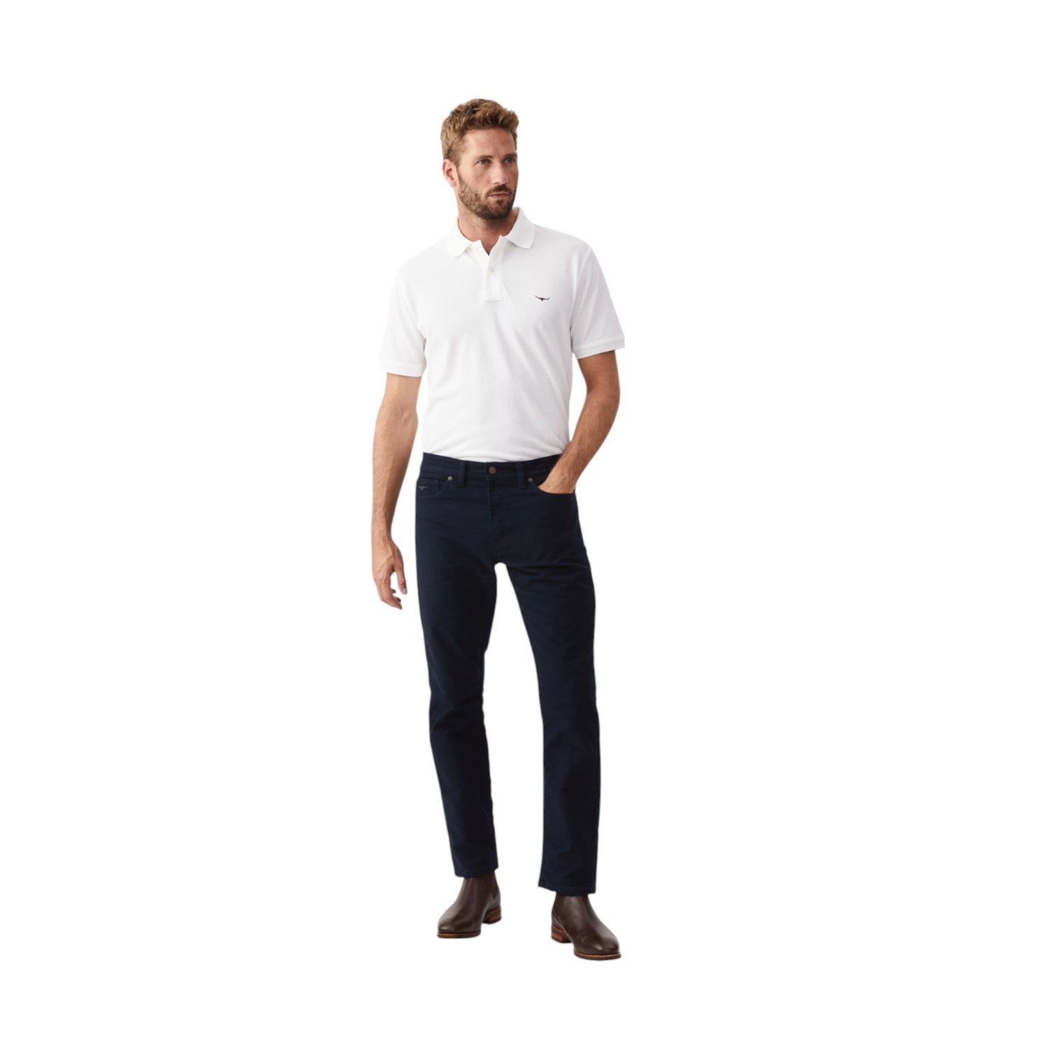 Man wearing a white polo shirt and dark pants on a white background