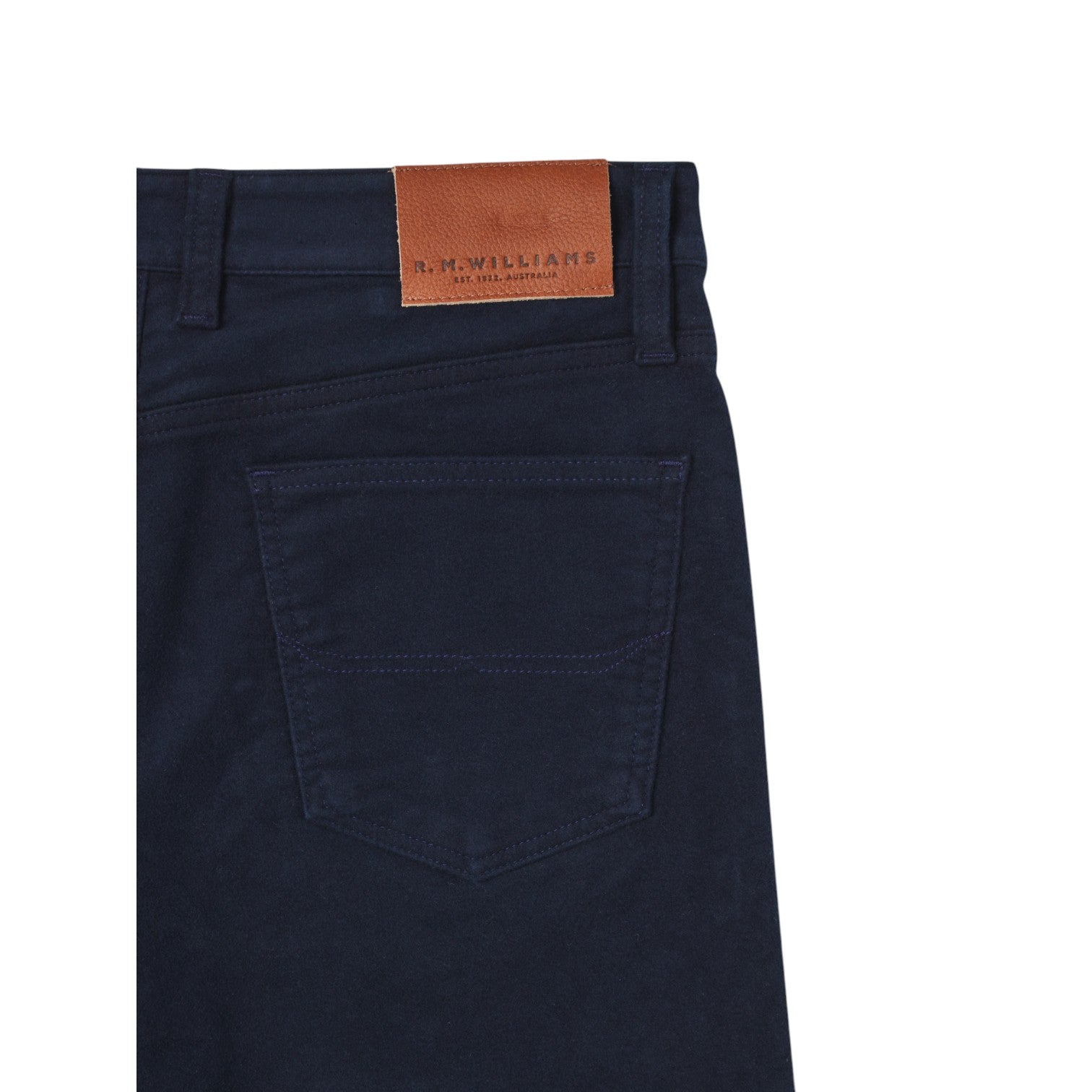 Navy blue pants with a brown leather label on a white background