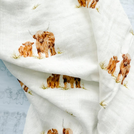 White fabric with brown dog print on a light blue background
