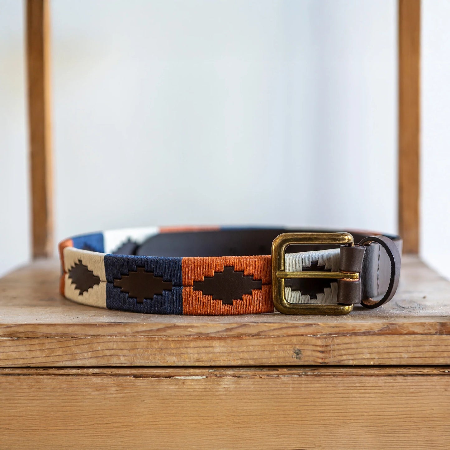 Dog collar with a geometric pattern on a wooden surface