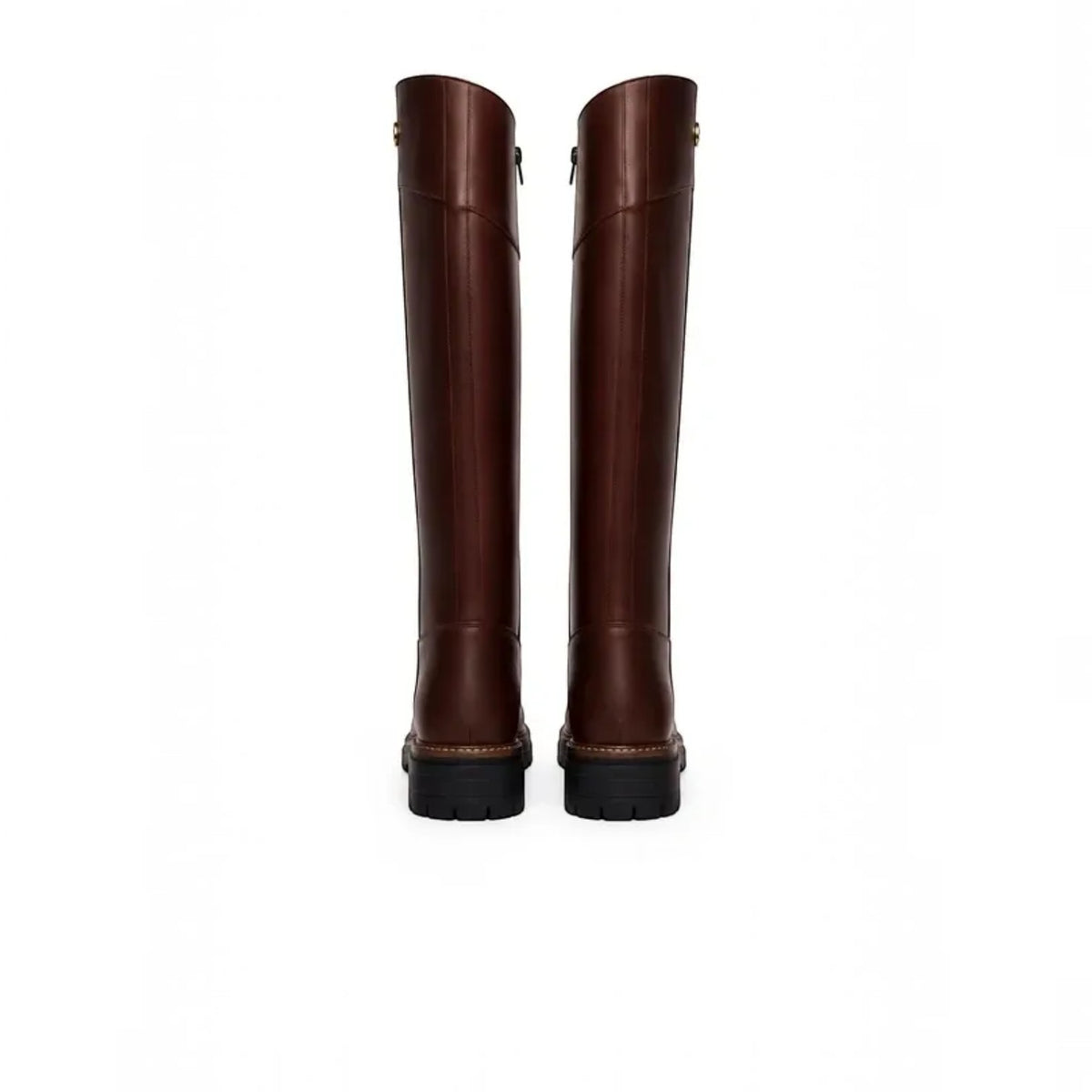 A pair of tall dark brown leather riding boots shown from the back, featuring black soles and subtle gold-tone hardware near the top, set against a plain white background.