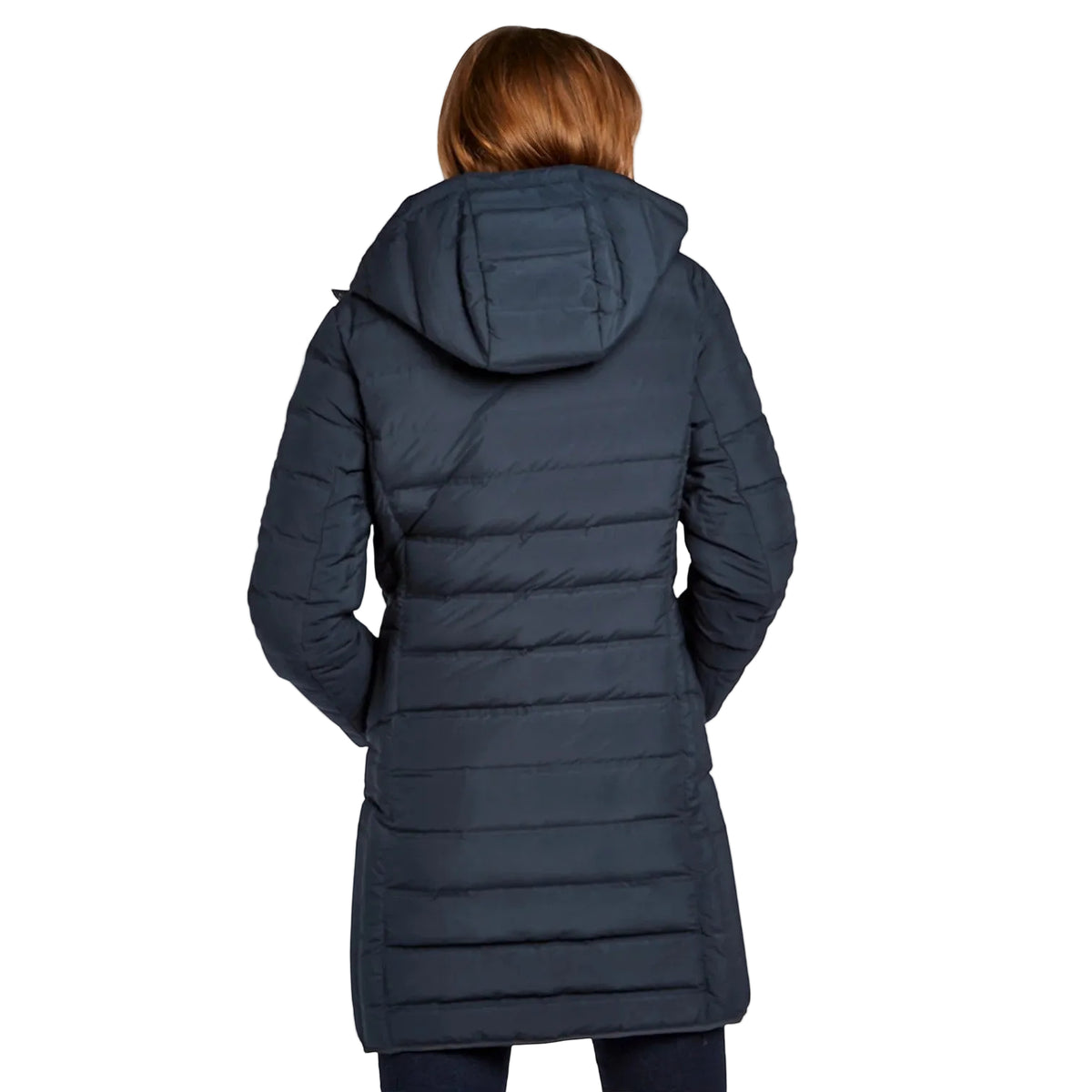 A woman viewed from the back wearing a dark navy hooded puffer coat against a plain white studio background.