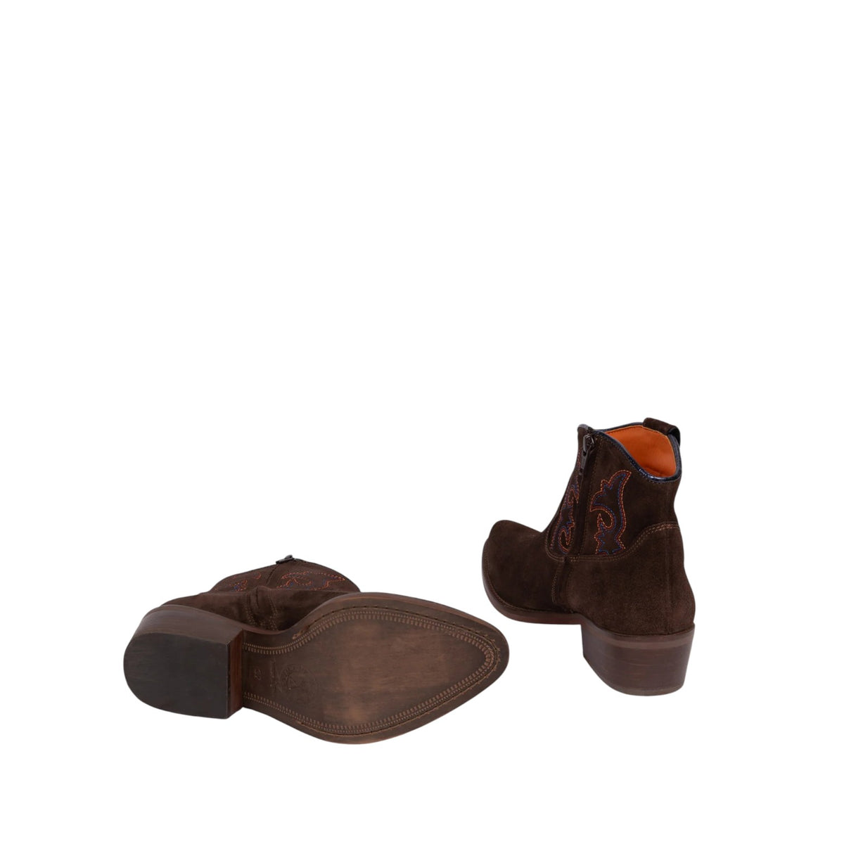 A pair of dark brown suede western ankle boots, one showing the side profile with embroidered detailing and the other showing the sole, on a plain white background.