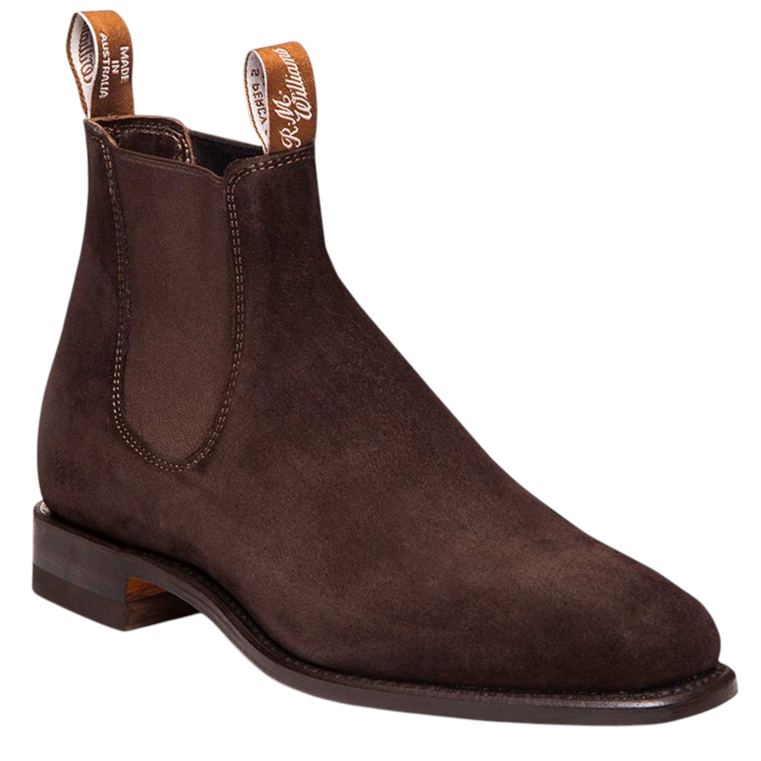 A dark brown suede Chelsea boot with elastic side panels and pull tabs, shown from a three-quarters angle on a white background.