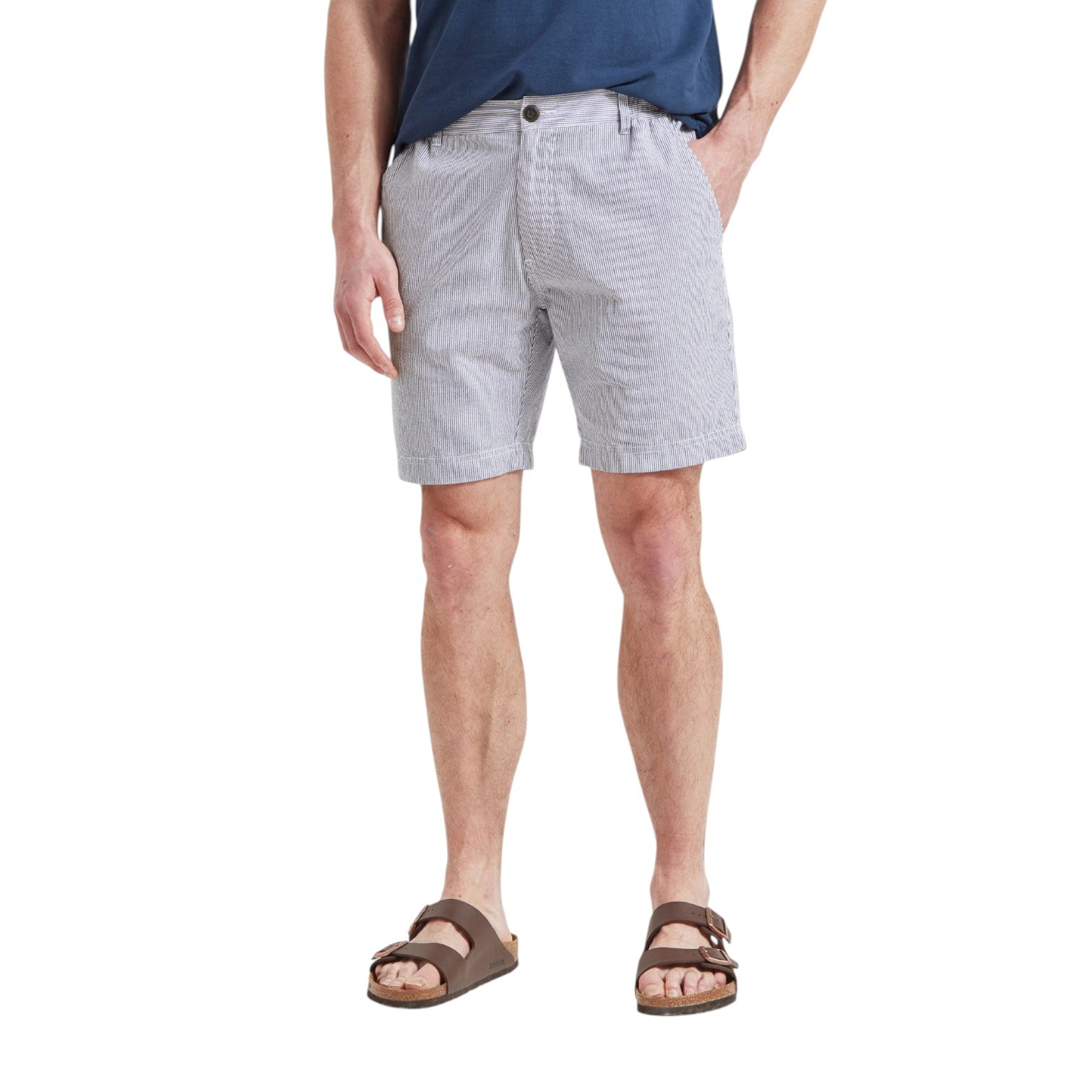 Person wearing gray checkered shorts on a white background