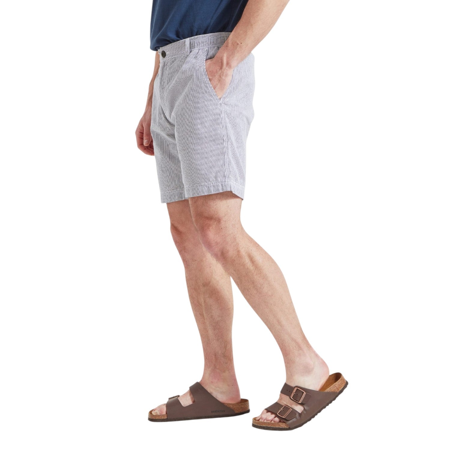 Person wearing light gray shorts on a white background